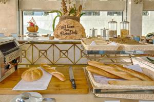 a group of breads on a table in a bakery at Paris Deli Danang Beach Hotel in Danang