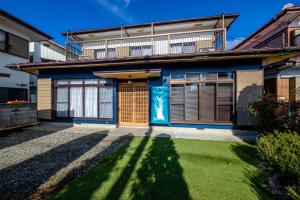 a house with a blue painting on the front of it at ID-STAY河口湖Ⅲ in Fujikawaguchiko