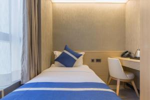 En eller flere senger på et rom på Lumine Hotel