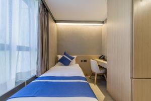 En eller flere senger på et rom på Lumine Hotel