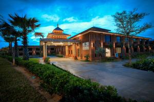 a building with a clock tower on top of it at Acacia Hotel Bagan in Bagan