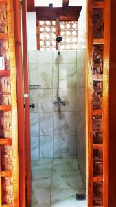 a glass shower door with a spider inside of it at MJ Room Rental Mahogany in Dauis