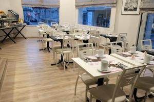 Um restaurante ou outro lugar para comer em Hotel Continental