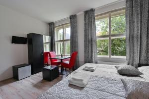 Posteľ alebo postele v izbe v ubytovaní Rabie Aparthotel