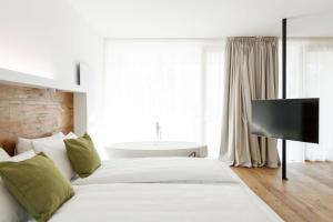 Postel nebo postele na pokoji v ubytování ALEA - Garda Lake Suite