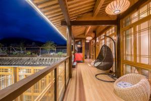 Balkón nebo terasa v ubytování Floral Tengchong Mountain hotel