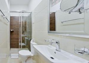 Kúpeľňa v ubytovaní Rabie Aparthotel