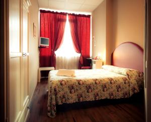 Postel nebo postele na pokoji v ubytování Ankon Hotel