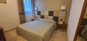 Ένα ή περισσότερα κρεβάτια σε δωμάτιο στο Hotel Classensis