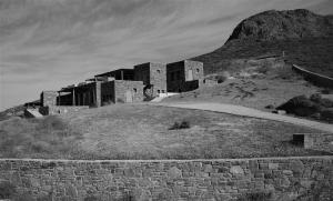 a black and white photo of a building on a hill at deep blue villas, Serifos in Serifos Chora