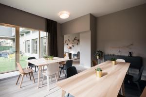 a living room filled with furniture and a table at Someso Apartamentos Turisticos in A Coruña