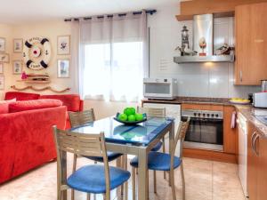 a kitchen and dining room with a table and chairs at Apartment Fane De Baix I by Interhome in Llança +17 photos