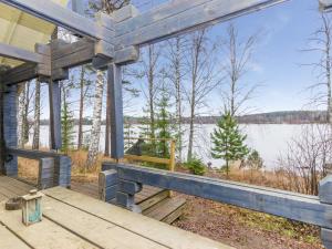 a porch of a house with a view of a lake at Holiday Home Lakka by Interhome in Hauho