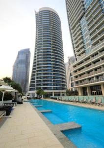 a swimming pool in front of two tall buildings at H Luxury Apartment at Surfers Paradise High floor in Gold Coast