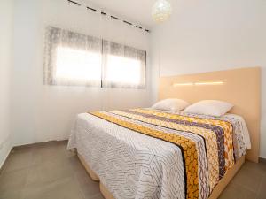 a bedroom with a bed and a window at Apartment Calpe Beach I-1 by Interhome in Calpe