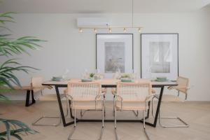 a dining room with a table and chairs at Liiiving in Porto - Luxury Beachfront Apartments in Porto