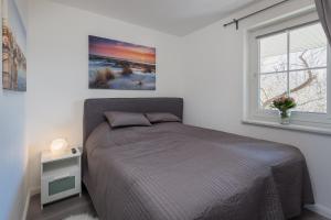מיטה או מיטות בחדר ב-Ostsee-Fördeblick