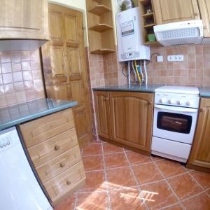 Kuchyňa alebo kuchynka v ubytovaní Dávid Apartman