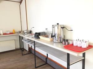 a kitchen with a counter with a mixer on it at Haiken Hostal in Punta Arenas