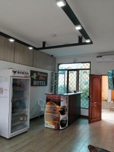 an empty room with a refrigerator and a counter at Hotel Platinum Class in Nueva Loja