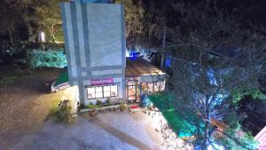 an overhead view of a building at night at PULI GuanPu Fallsview Stay House in Puli