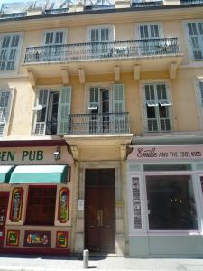 a building with two shops in front of it at Résidence Pearl in Nice