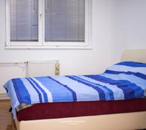 Postel nebo postele na pokoji v ubytování Dusko dugousko