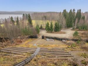 an aerial view of a park with trees and a lake at Holiday Home Härkälinna by Interhome in Hauho