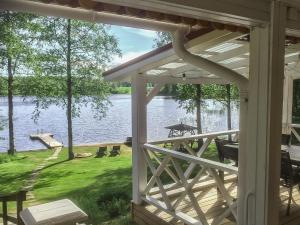 a view of a lake from the porch of a house at Holiday Home Villa siesta by Interhome in Torvoila