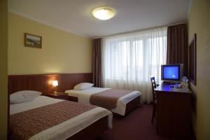 Кровать или кровати в номере Hotel Mir