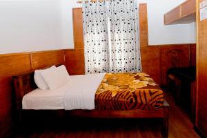 Postel nebo postele na pokoji v ubytování Sapu's Mountain breeze Nuwara Eliya