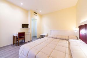 Postel nebo postele na pokoji v ubytování Park Hotel