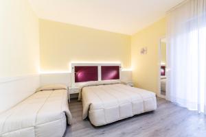 Postel nebo postele na pokoji v ubytování Park Hotel