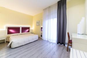 Postel nebo postele na pokoji v ubytování Park Hotel