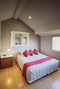 A bed or beds in a room at Jesmond Executive Villas