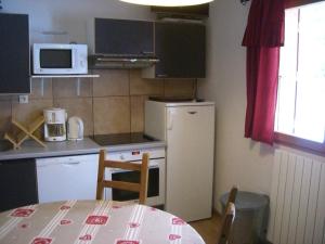 Kuchyň nebo kuchyňský kout v ubytování Appartement Claparelle - Les 2 Alpes