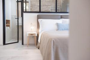 Voodi või voodid majutusasutuse Petrantiche - Albergo Diffuso toas