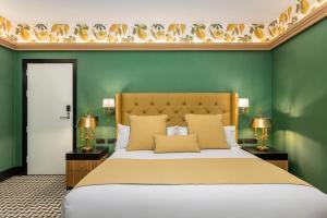 A bed or beds in a room at Room Mate Collection Alba, Madrid