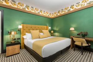 A bed or beds in a room at Room Mate Collection Alba, Madrid