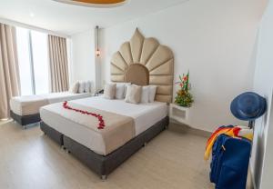 Postel nebo postele na pokoji v ubytování Hotel Cartagena Dubai