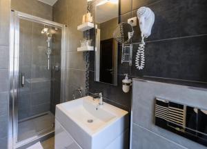 Kúpeľňa v ubytovaní Hotel Villa Völgy Wellness & Konferencia