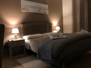 En eller flere senge i et værelse på B&B Altamarea