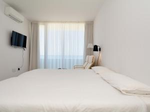 Łóżko lub łóżka w pokoju w obiekcie Luxe Penthouse Casa Atlantica Morro Jable Sea Views By PVL