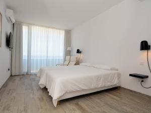 Łóżko lub łóżka w pokoju w obiekcie Luxe Penthouse Casa Atlantica Morro Jable Sea Views By PVL