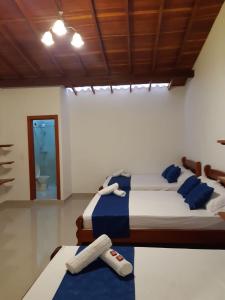 Postel nebo postele na pokoji v ubytování Hotel Jardín de Rosas