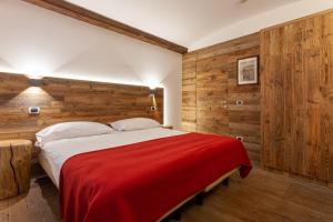 En eller flere senge i et værelse på Residence Le Grand Chalet