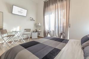 Postel nebo postele na pokoji v ubytování Scirocco Rooms
