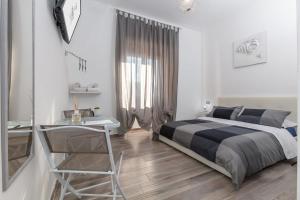 Postel nebo postele na pokoji v ubytování Scirocco Rooms