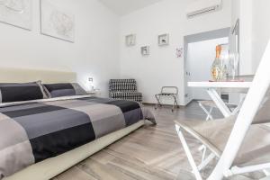 Postel nebo postele na pokoji v ubytování Scirocco Rooms