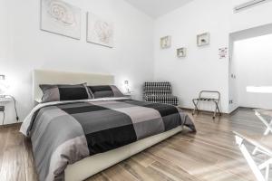 Postel nebo postele na pokoji v ubytování Scirocco Rooms